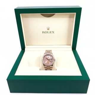 Rolex Day-Date or rose diamants